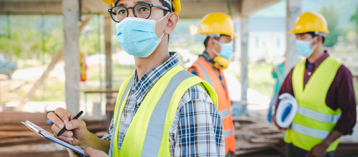 contractors working safely with face masks on sandwich ma